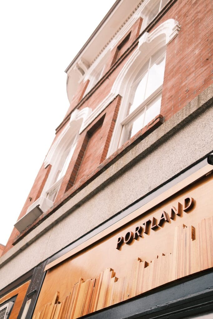 portland sign in all wood, taken in portland maine on a cloudy day